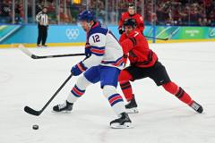 GOLDEN: U.S. Men Win Olympic Gold With 2-1 Overtime Victory Over Canada U.S. Men's Team Secures Olympic Gold After 2-1 Overtime Win Against Canada 31