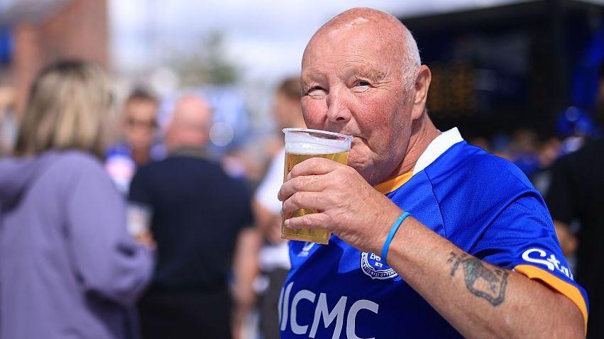 UK Prime Minister Andy Burnham backs allowing alcohol at football seats 7